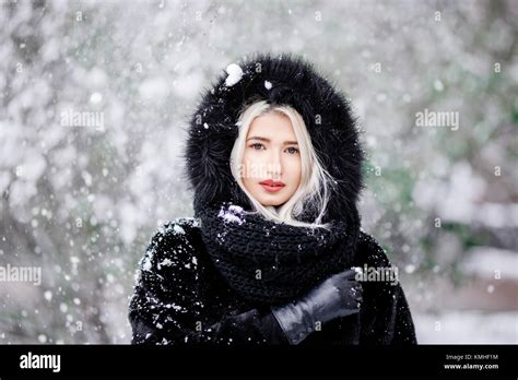 Portrait Of Beautiful Blonde Girl In A Warm Fur Coat Outdoor In A Snowy Forest Stock Photo Alamy