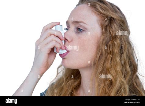 Pretty Blonde Using An Asthma Inhaler Stock Photo Alamy