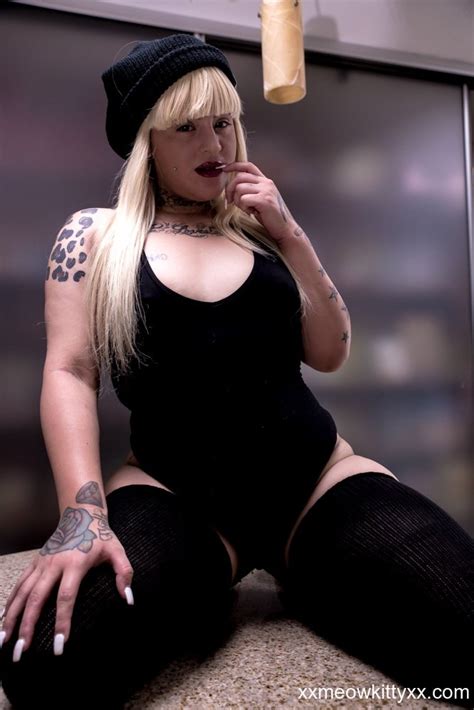 Tattooed Babe Slutty Natasha Poses In And Out Her Seductive Bodysuit Photos