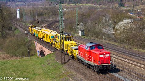 212 036 heads south at Gemünden am Main with track machine Flickr