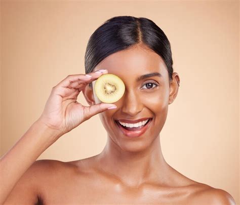 Premium Photo Portrait Beauty And Kiwi With A Model Woman In Studio