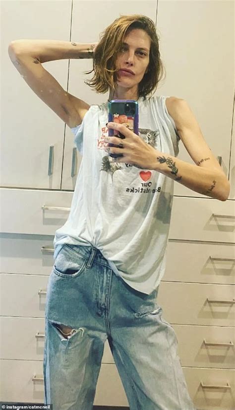 Catherine Mcneil Reveals Her Very Slender Frame As She Poses In Ripped Jeans And A Baggy Top