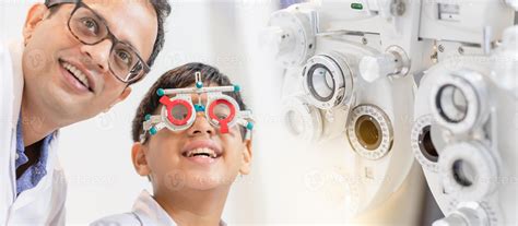 Banner style, Smiling Indian-thai boy choosing glasses in optics store