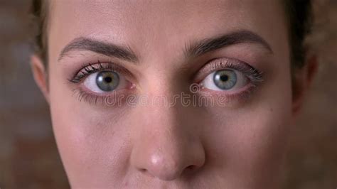 Beautiful Close Up Blue Eyes Of Caucasian Young Woman Who Is Looking