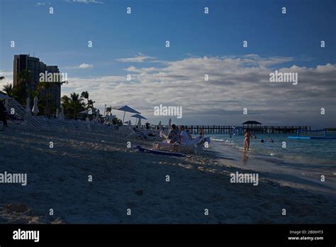 Wide Angle Landscape Of Crowds Of People Enjoying The Beach In The