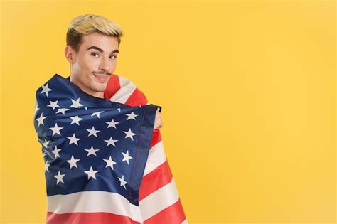 Premium Photo Cheerful Gay Man Wrapping With A North America National Flag