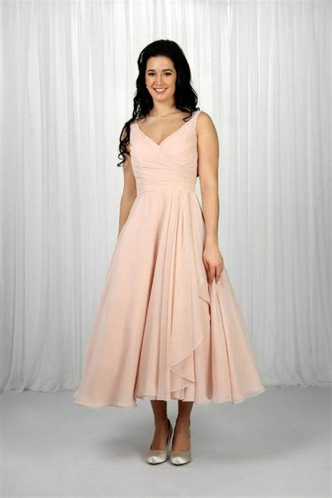 This Tea Length Bridesmaid Gown Has A Full Chiffon Skirt With A