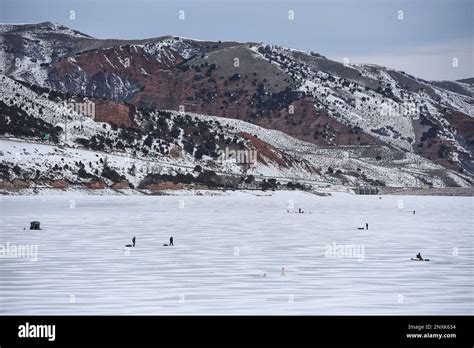 Ice Fishermen Speckle The Ice At Echo Reservoir With An Elevation Of
