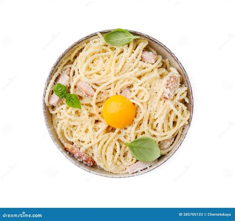 Bowl Of Tasty Pasta Carbonara With Basil Leaves And Egg Yolk Isolated