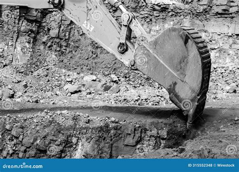 Construction Worker Operates A Digger On A Loader At A Job Site