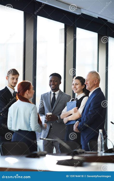 Cheerful Business Team Discussing Project Stock Photo Image Of