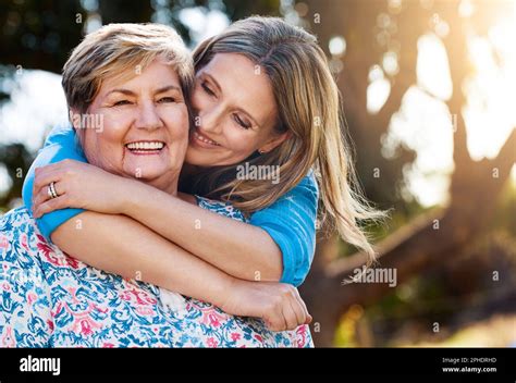 When Shes Happy Im Happy Portrait Of A Happy Mature Woman Hugging Her Mother Outdoors Stock