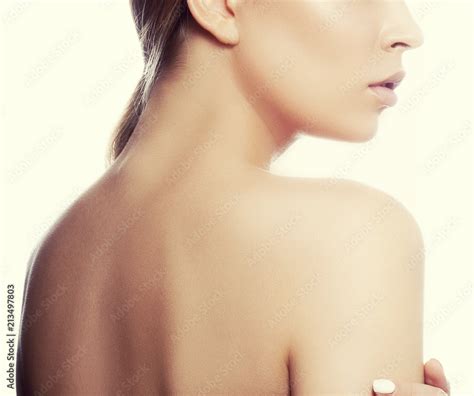 Natural Lips With Pale Lipstick Naked Back And Shoulder Part Of Face Of Model Girl With Nude
