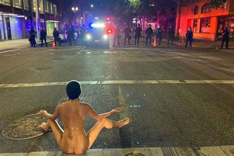 Bizarre Moment Naked Protester Doing Yoga In Street Forces Riot Police