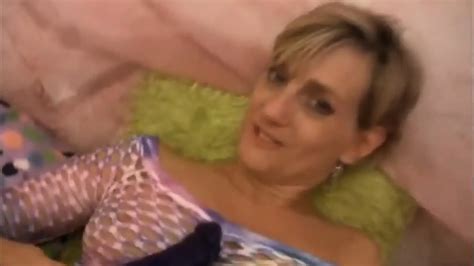 Short Haired Blonde Playing With Her Toys