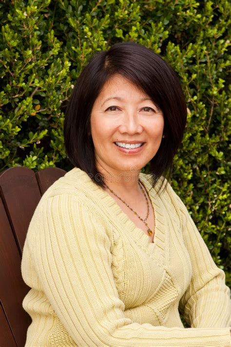 Beautiful Mature Asian Woman Sitting Outside Stock Photo Image Of