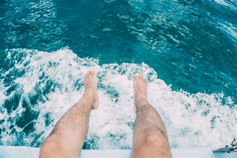 Person Swimming On Body Of Water Doing Freestyle Strokes · Free Stock Photo