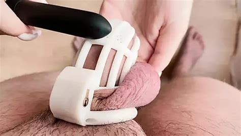 While A Cuckold In A Chastity Cage Licks Pussy She Practices Blowjob On A Dildo For Her Lover