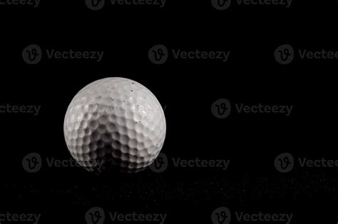Golf ball isolated on black background 22129422 Stock Photo at Vecteezy