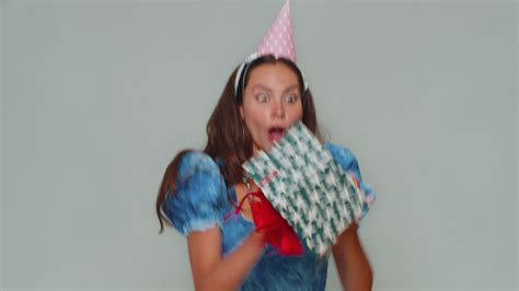 Smiling woman receiving gift box, amazed satisfied with nice present