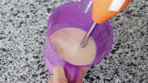 A Woman Whipping Light Pink Hot Milk In A Container At The Kitchen Stock Video Video Of Sweet