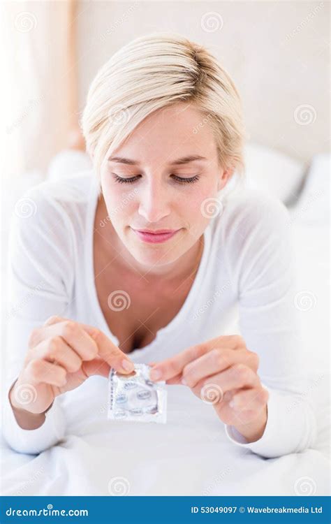 Smiling Blonde Woman Holding Condom Stock Image Image Of Condom Indoors 53049097