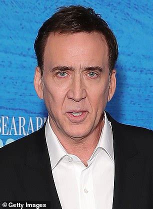 Nicolas Cage looks barely recognisable with BRIGHT RED locks as he