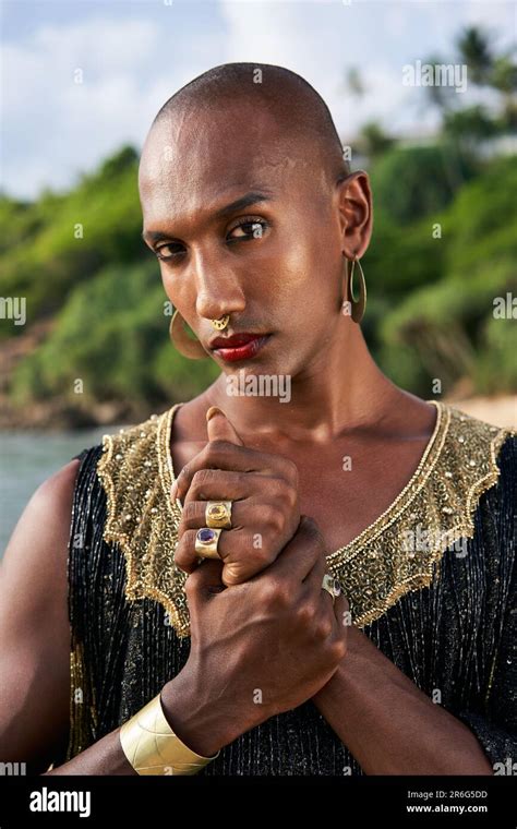 Gorgeous Gay Black Man In Luxury Gown Brass Jewelry Poses On Scenic Ocean Beach Non Binary