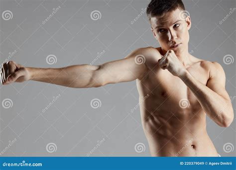 Guy Are Boxing On Gray Background And Naked Torso Muscle Bodybuilder Cropped View Royalty Free