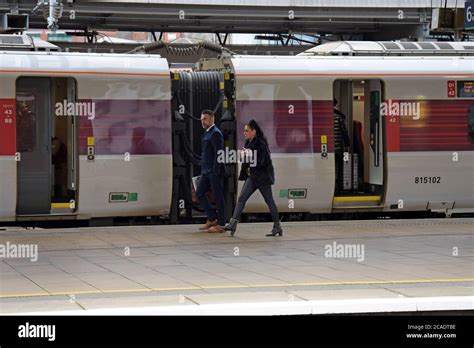 A Smartly Dressed Couple Catching An Lner Azuma Electric Train At Leeds