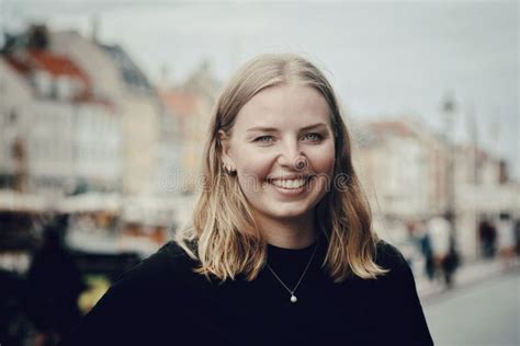 Beautiful Blonde Caucasian Woman Portrait Smiling At The Camera In Copenhagen Denmark Stock