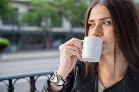 Premium Photo Portrait Of Young Woman Drinking Coffee