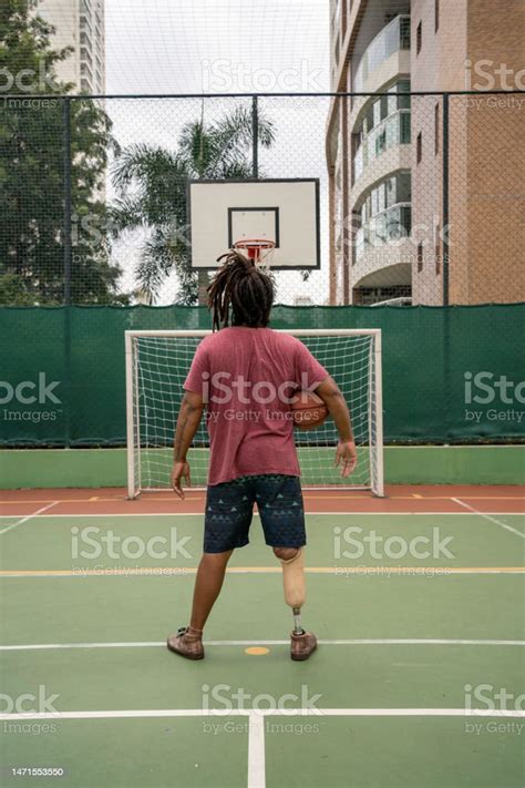 Man With Leg Prosthesis Playing Basketball Stock Photo Download Image