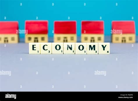 Figurine Wooden Houses On Blue Background Stock Photo Alamy