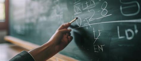 Premium Photo Hand Holding Chalk And Writing Mathematical Equations