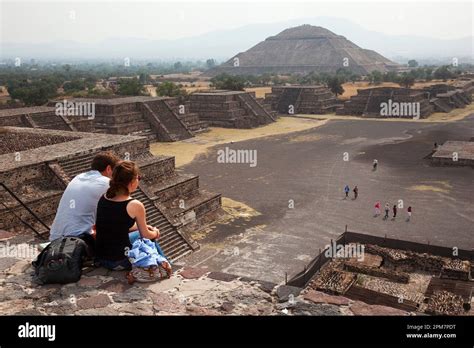 Tourists Sitting At The Stairs Of The Pyramid Of The Moon Piramide De