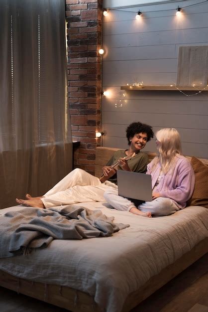 Free Photo Lesbian Couple Looking On Their Laptop