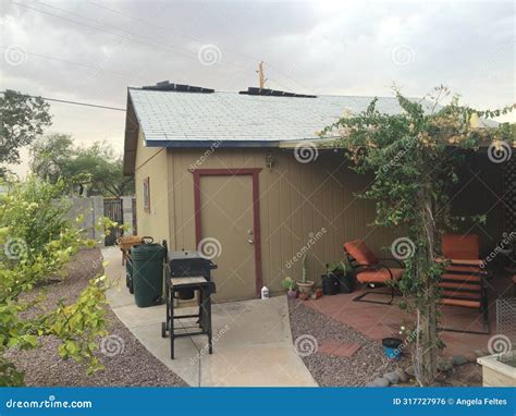 Loose Shingles Blowing On My Roof In A Storm Garage In Arizona Stock