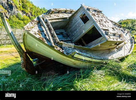 Old Boat Wreck On The Green Grass Stock Photo Alamy