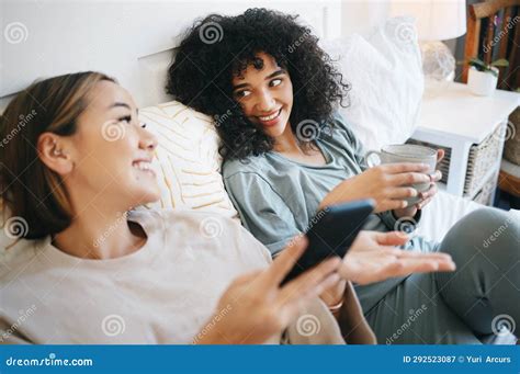 Phone Coffee And Lesbian Couple On Bed In Conversation For Bonding Relaxing And Resting