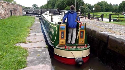 English Canal Narrowboat Going Through A Lock In Stone Staffordshire August 2010 By Workhouse