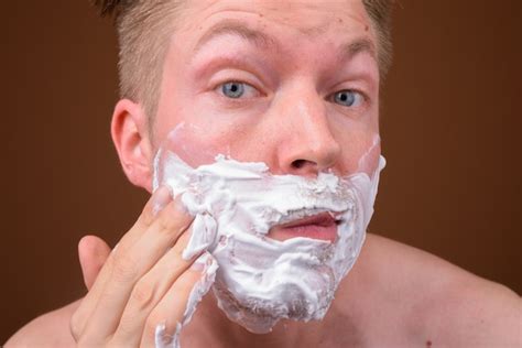 Premium Photo Young Handsome Man Shirtless While Grooming