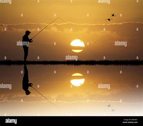 fisherman at sunset Stock Photo - Alamy