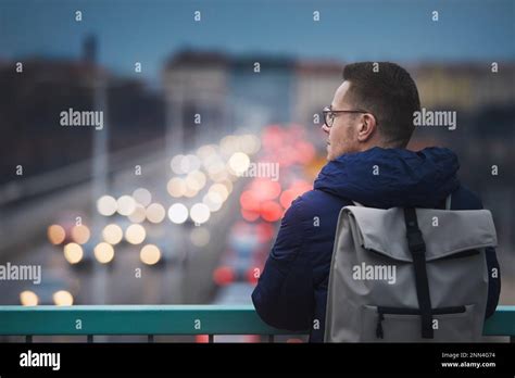 Man Looking At Busy City Street Portrait Against Urban Scene With Cars