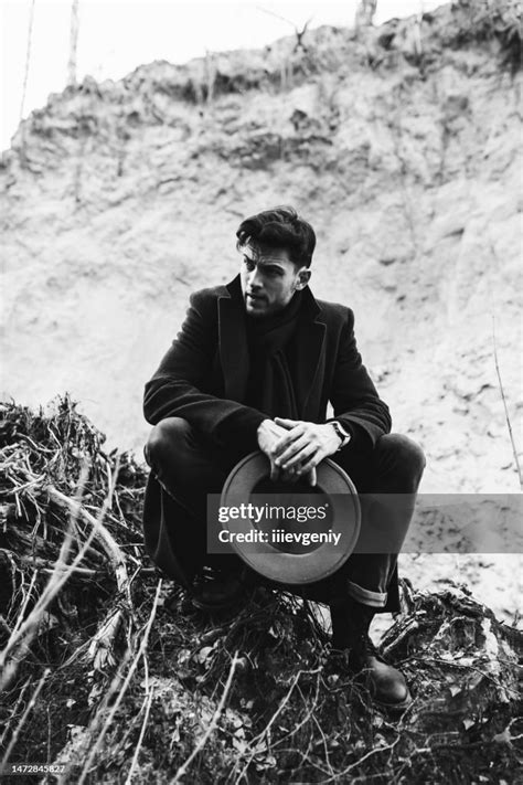 Male Portrait Brunet Man In Hat And Coat In Forest Black And White