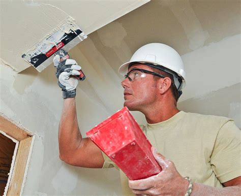 Applying drywall joint compound | Tech. Sgt. Russell Hunt of… | Flickr