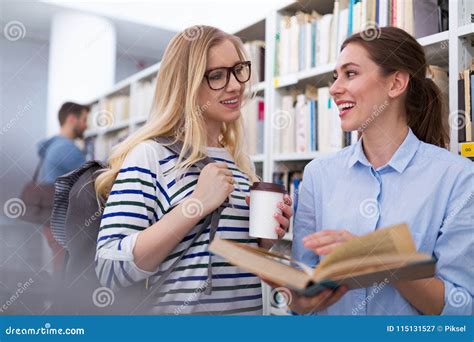 Students Working In The Library At Campus Stock Image Image Of Casual