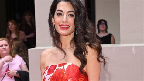 Amal Clooney Stunned in a Red Floral Gown in London | Marie Claire