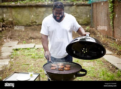 Man Cooking Hamburgers Hi Res Stock Photography And Images Alamy