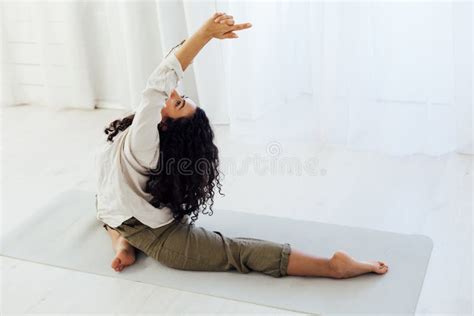 Beautiful Woman Brunette Engaged In Yoga Asana Gymnastics Flexibility Stock Photo Image Of